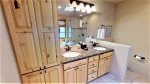 Double vanity sinks with granite counter tops and great lighting